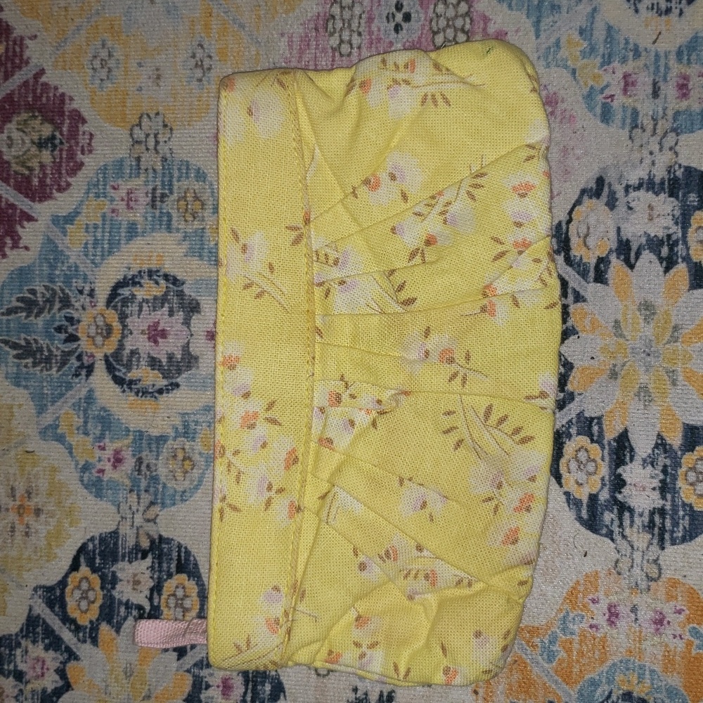 OLD NAVY CLUTCH YELLOEWNWITH WHITE AND PEACH COLORED FLOWERS.